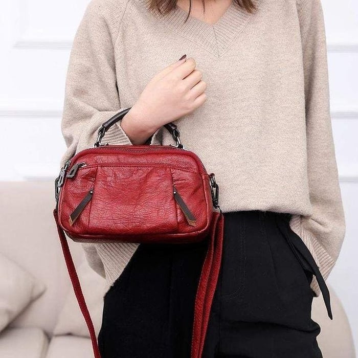 Finbjørg | Kleine und vielseitige Tasche in goldenem Cognac-Ton