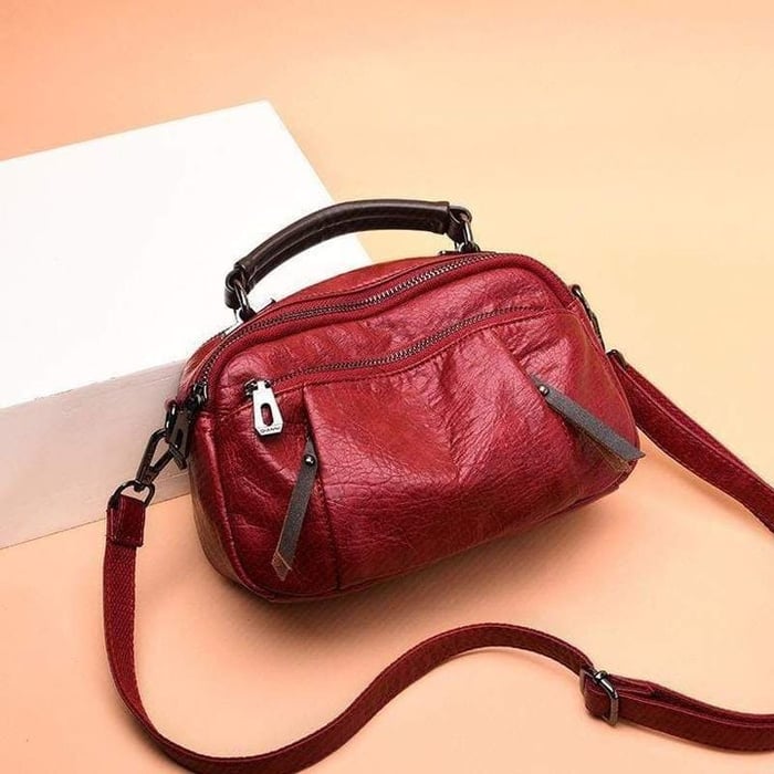 Finbjørg | Kleine und vielseitige Tasche in goldenem Cognac-Ton