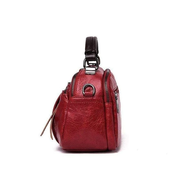 Finbjørg | Kleine und vielseitige Tasche in goldenem Cognac-Ton