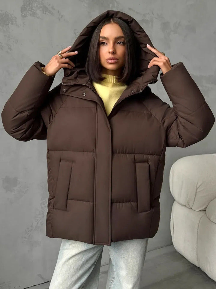Damen Oversized Steppjacke mit Kapuze und integrierten Taschen