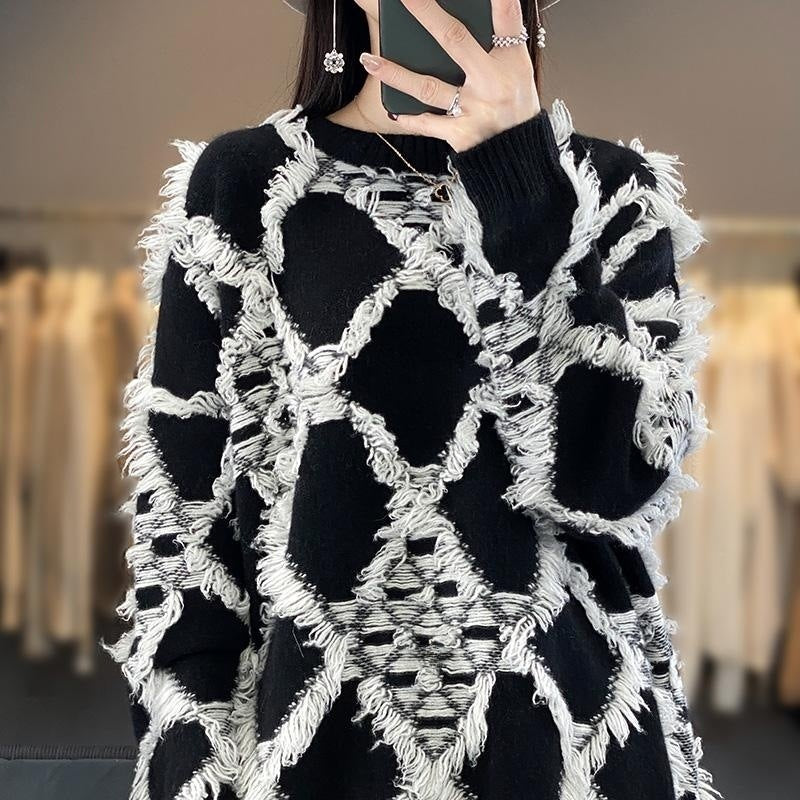 Γυναικείο oversized πουλόβερ με στρογγυλή λαιμόκοψη και κρόσσια