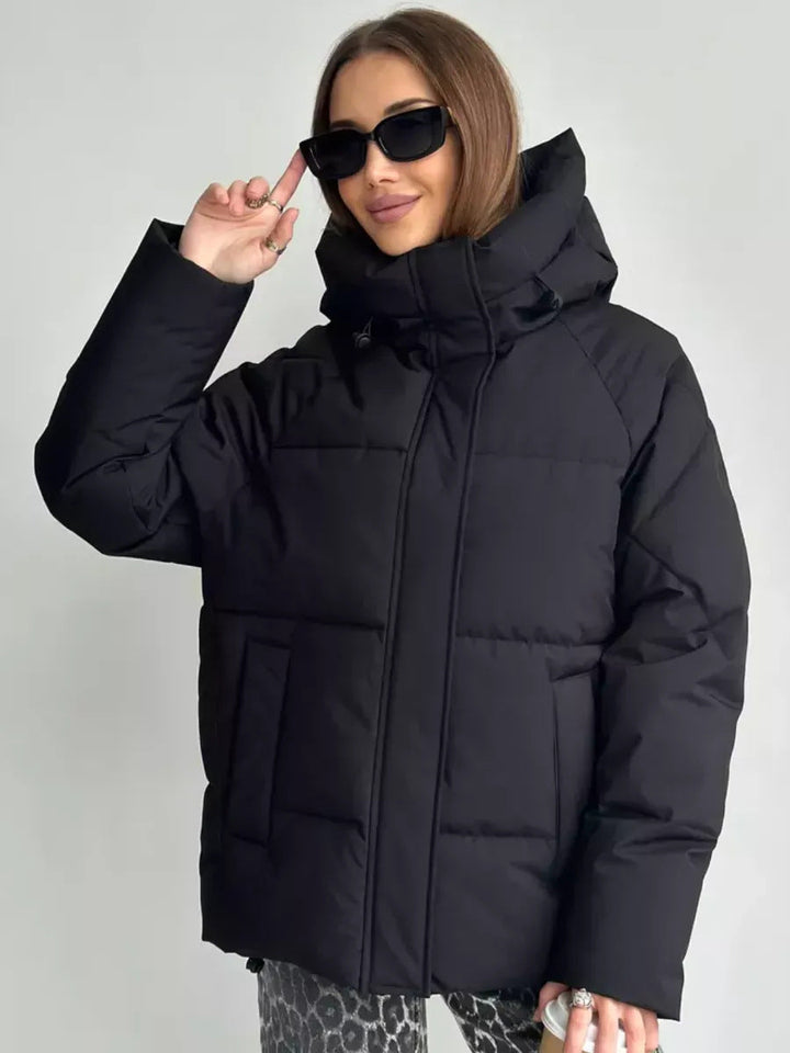 Damen Oversized Steppjacke mit Kapuze und integrierten Taschen