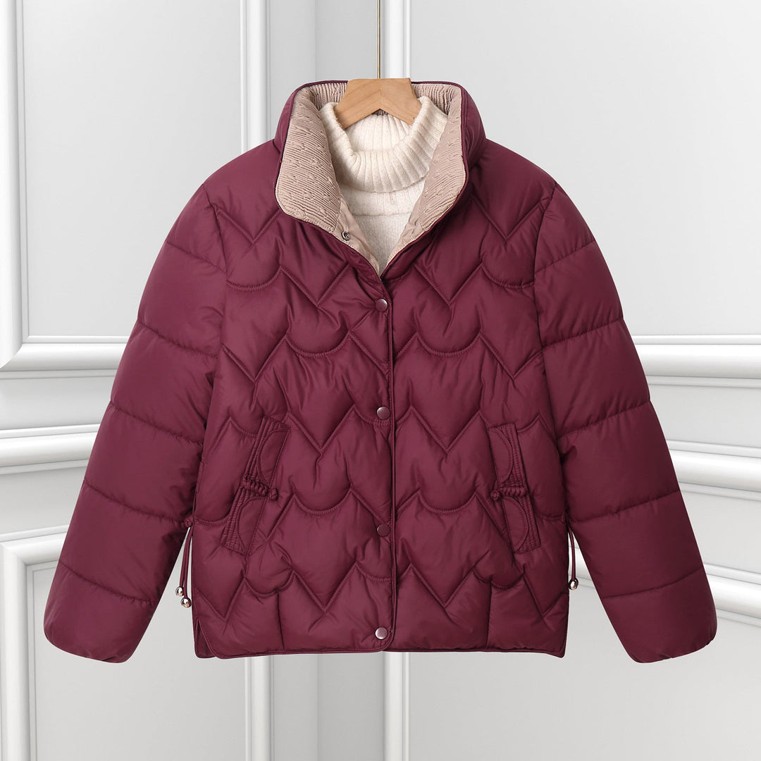 Women’s short quilted puffer jacket with arched quilting and snap-button placket