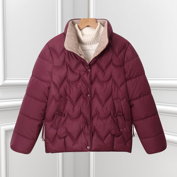 Women’s short quilted puffer jacket with arched quilting and snap-button placket
