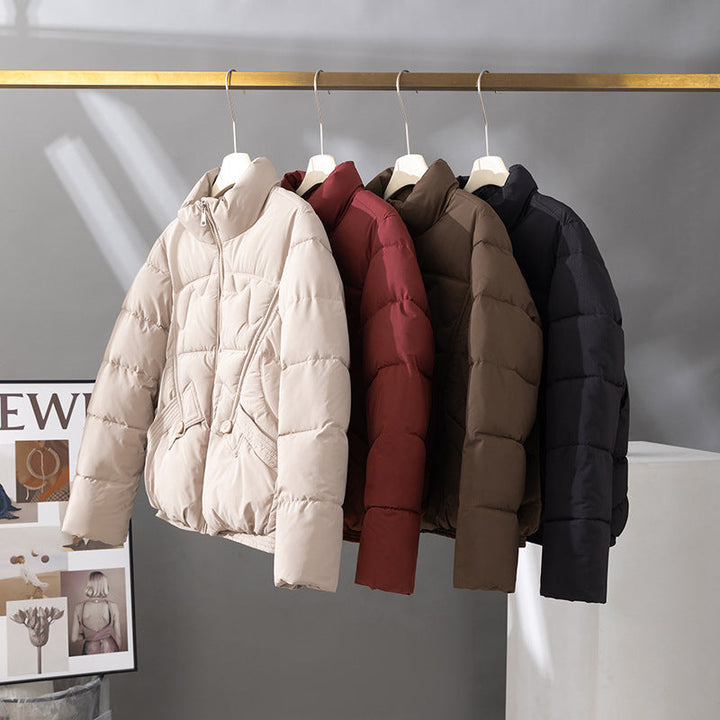 Women's short quilted blouson jacket with a high collar and flap pockets