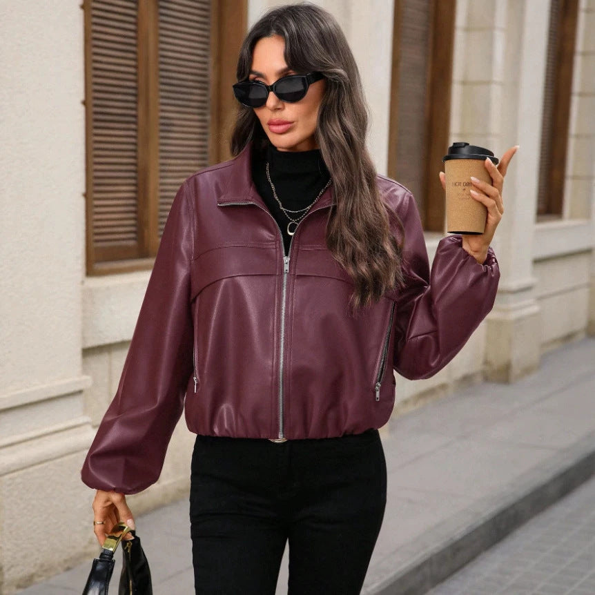 Women's cropped faux leather jacket with zippered pockets and a fitted cut