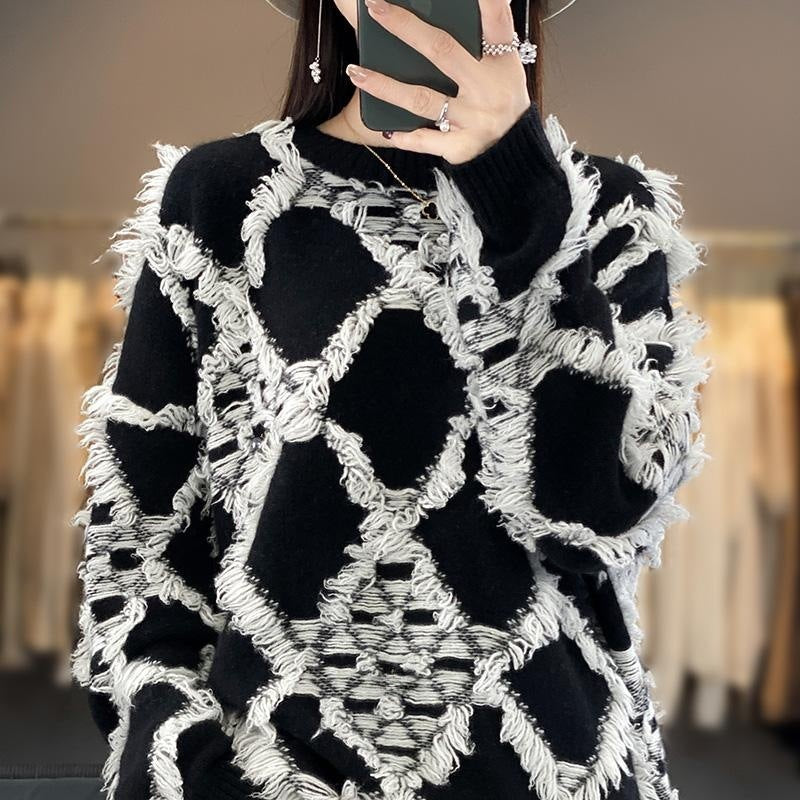 Γυναικείο oversized πουλόβερ με στρογγυλή λαιμόκοψη και κρόσσια