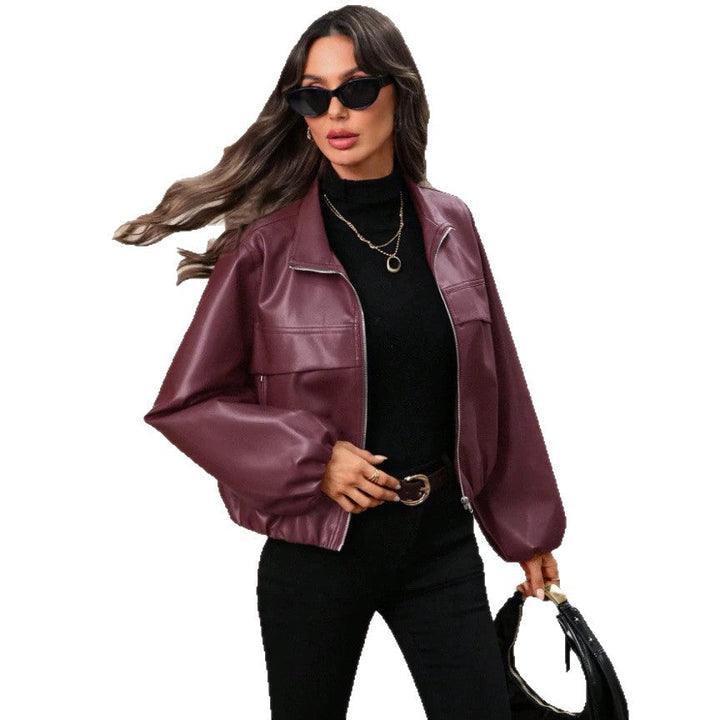 Women's cropped faux leather jacket with zippered pockets and a fitted cut