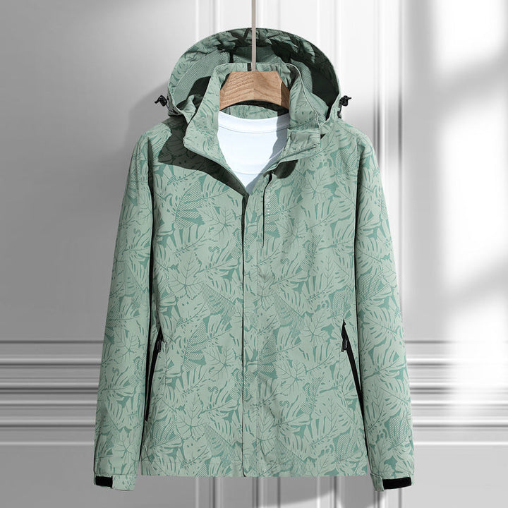 Damen leichte packbare Regen- und Windjacke mit Kapuze, Blattmuster