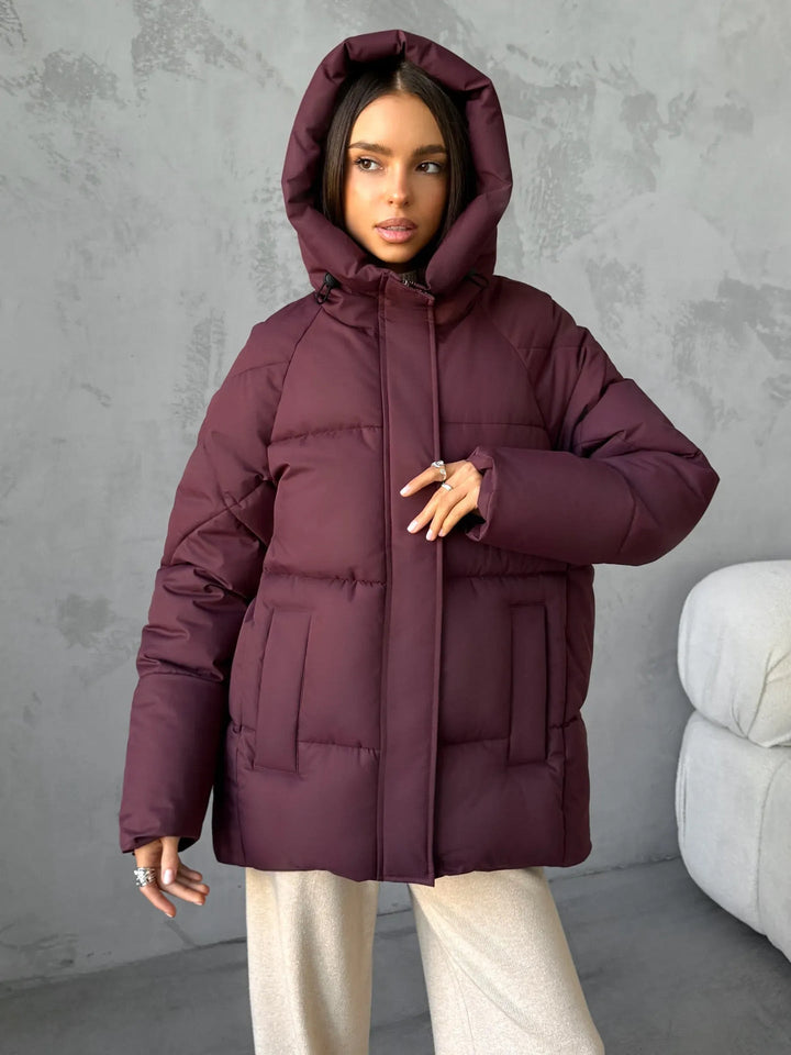 Damen Oversized Steppjacke mit Kapuze und integrierten Taschen