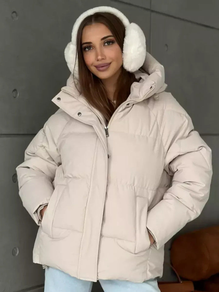 Damen Oversized Steppjacke mit Kapuze und integrierten Taschen