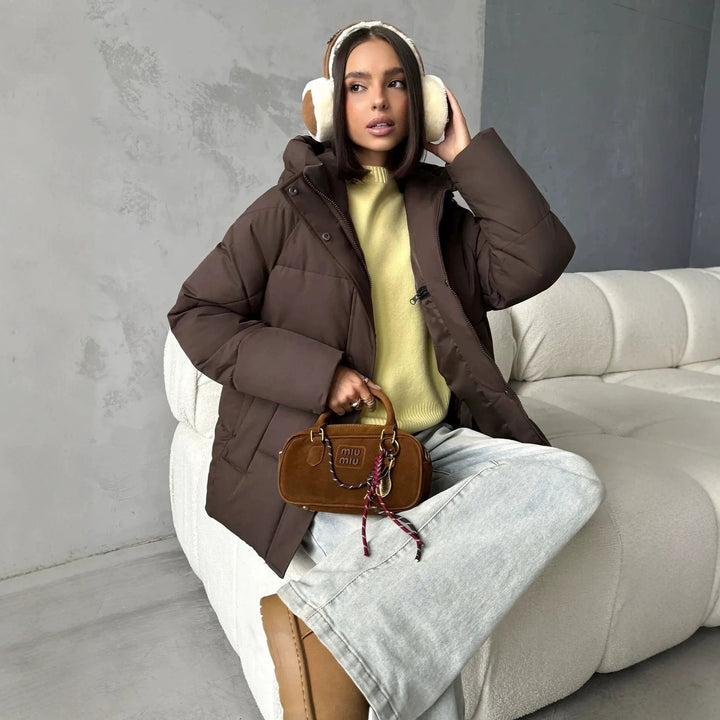 Damen Oversized Steppjacke mit Kapuze und integrierten Taschen