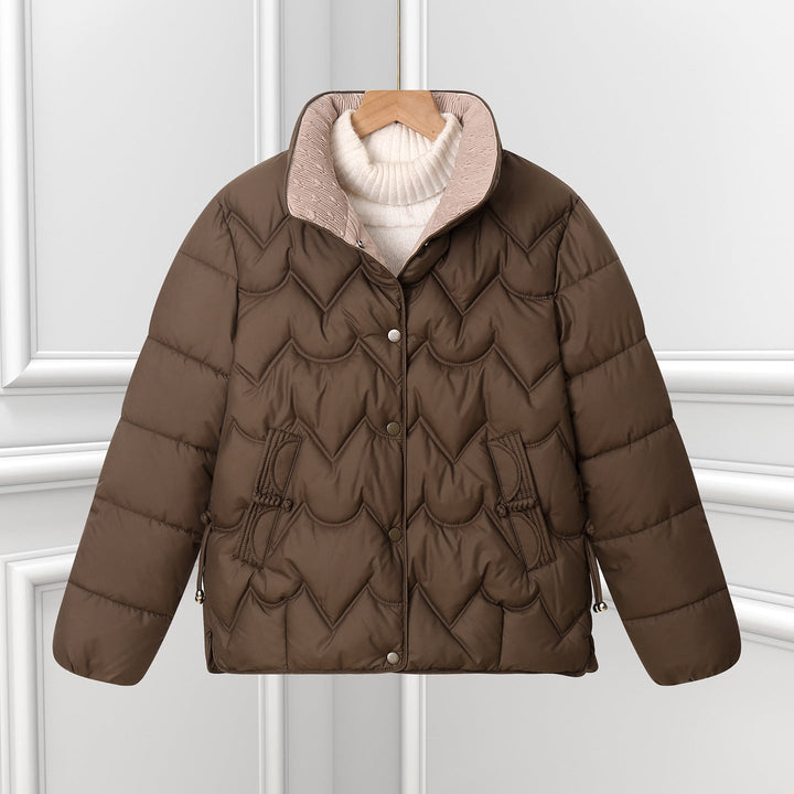 Women’s short quilted puffer jacket with arched quilting and snap-button placket