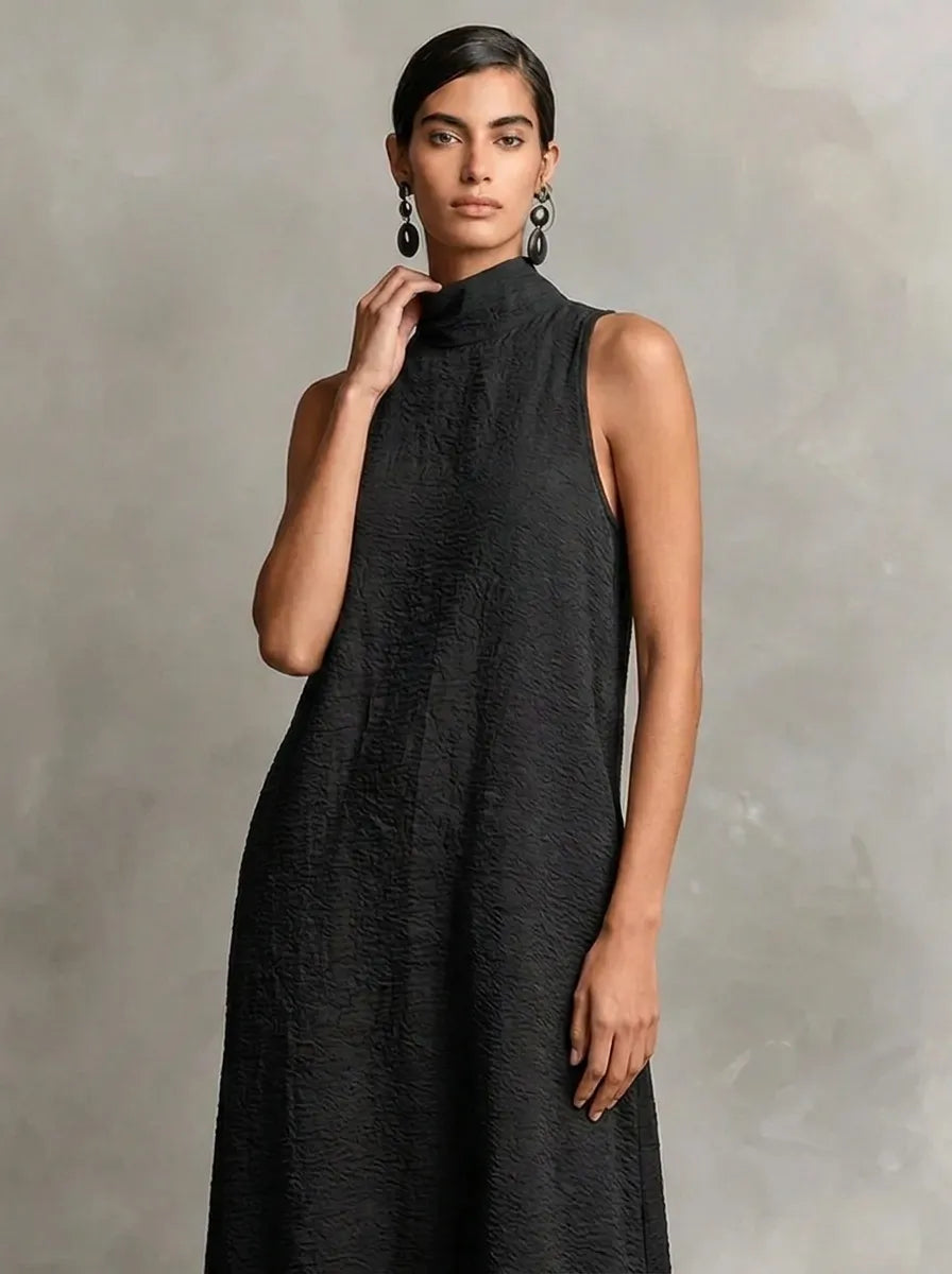 Robe longue noire pour femme à col montant et poches latérales, robe décontractée intemporelle et minimaliste