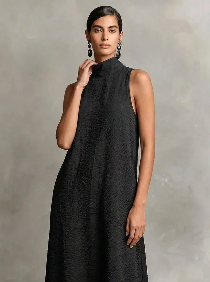 Robe longue noire pour femme à col montant et poches latérales, robe décontractée intemporelle et minimaliste